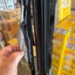 Damaged door seal on a commercial fridge showing cracks and gaps, leading to cold air loss and reduced efficiency.