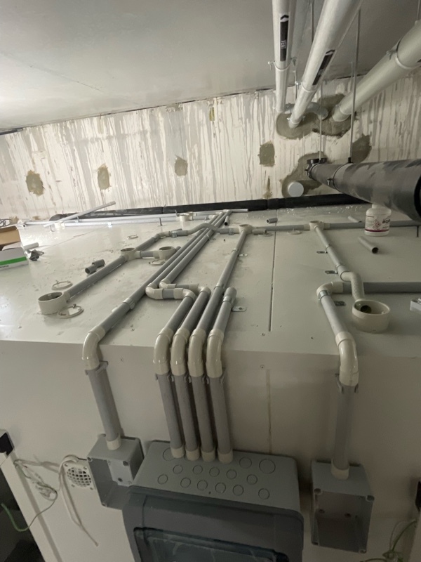 Neatly installed electrical conduit running along the exterior of a commercial cold room by Acro Refrigeration