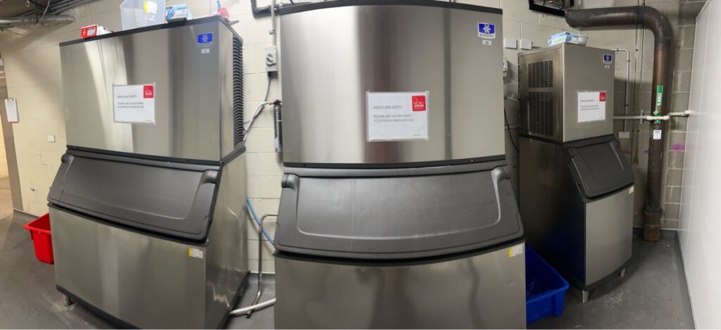 Three ice machines and storage bins in a hotel