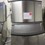 Three ice machines and storage bins in a hotel