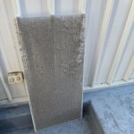 a return air grill covered in dust